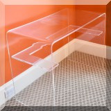F13. Clear acrylic writing desk. 27”h x 36”w x 18”d 